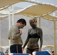 People slathering themselves with Dead Sea mud, Isreal