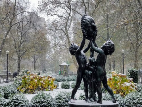 Philadelphia's Rittenhouse Square statue during a November snowfall